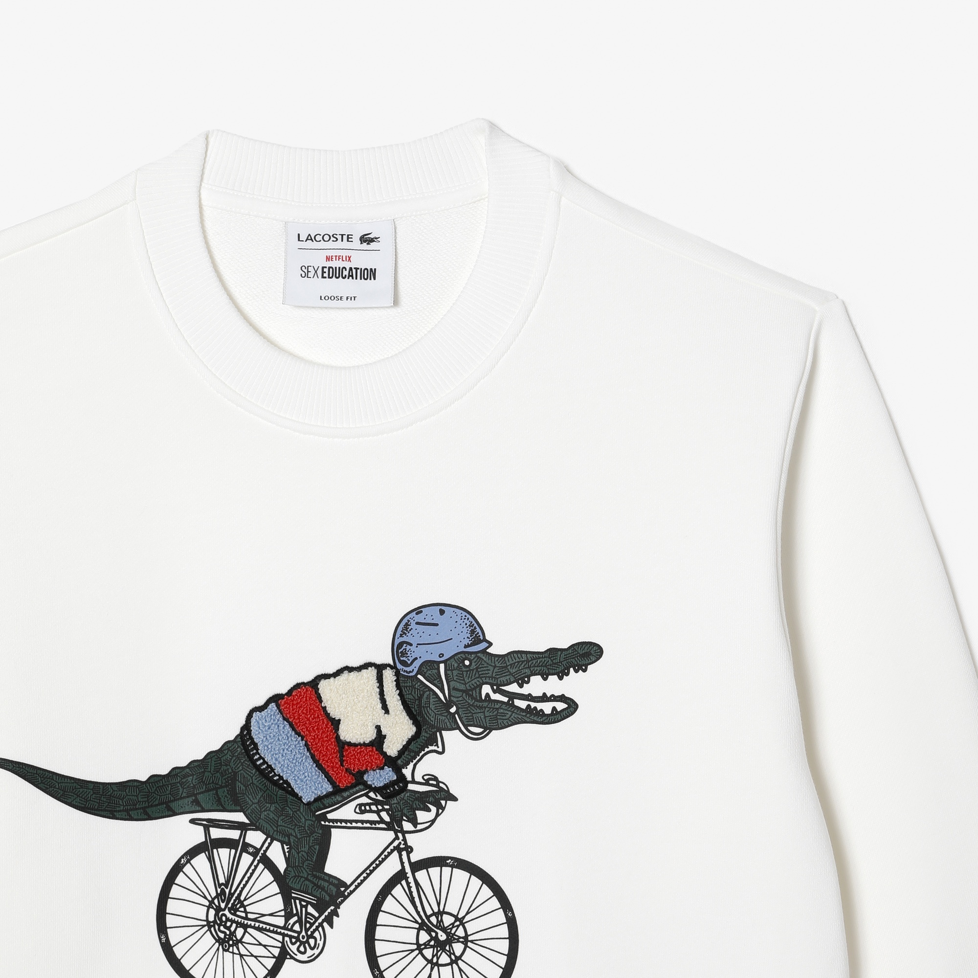 Lacoste x Netflix Kadın Loose Fit Bisiklet Yaka Baskılı Beyaz Sweatshirt