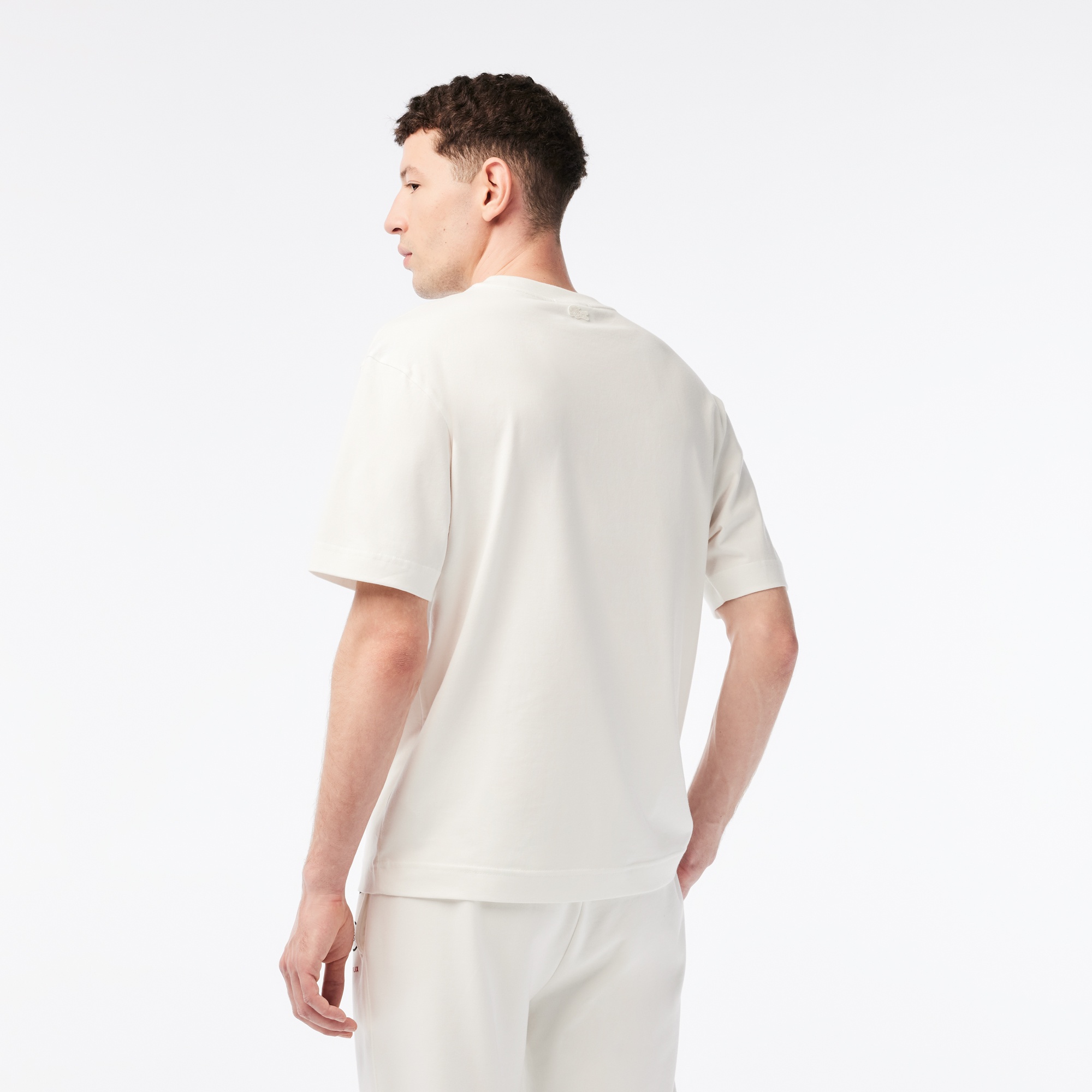 Lacoste x Netflix Erkek Relaxed Fit Bisiklet Yaka Baskılı Bej T-shirt